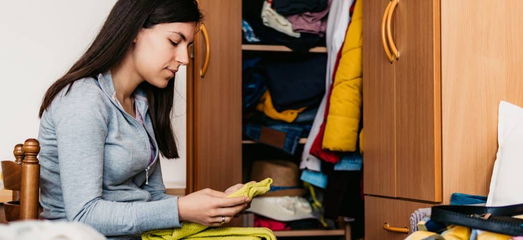 Woman organizing closet