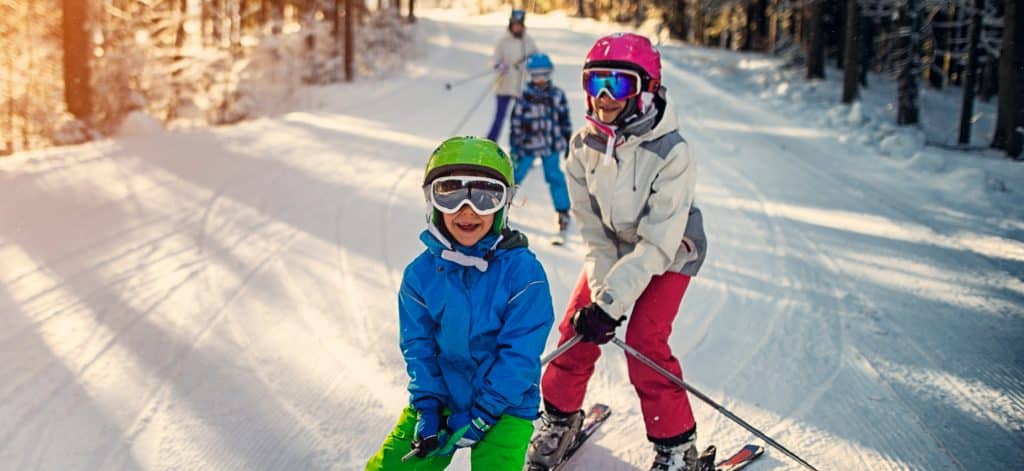 Family skiing downhil