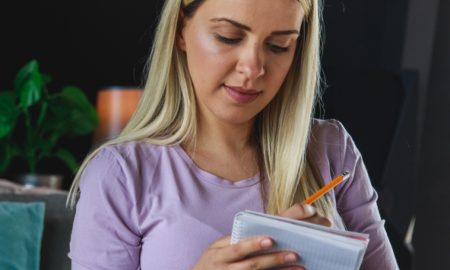 Pregnant mother writing a list