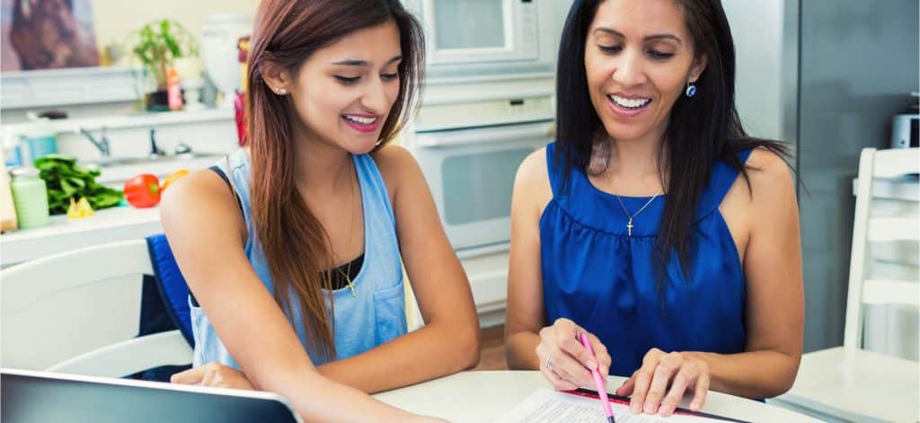 Mother and daughter filling out college application
