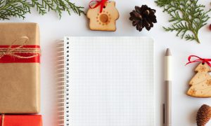 notebook surrounded by holiday elements