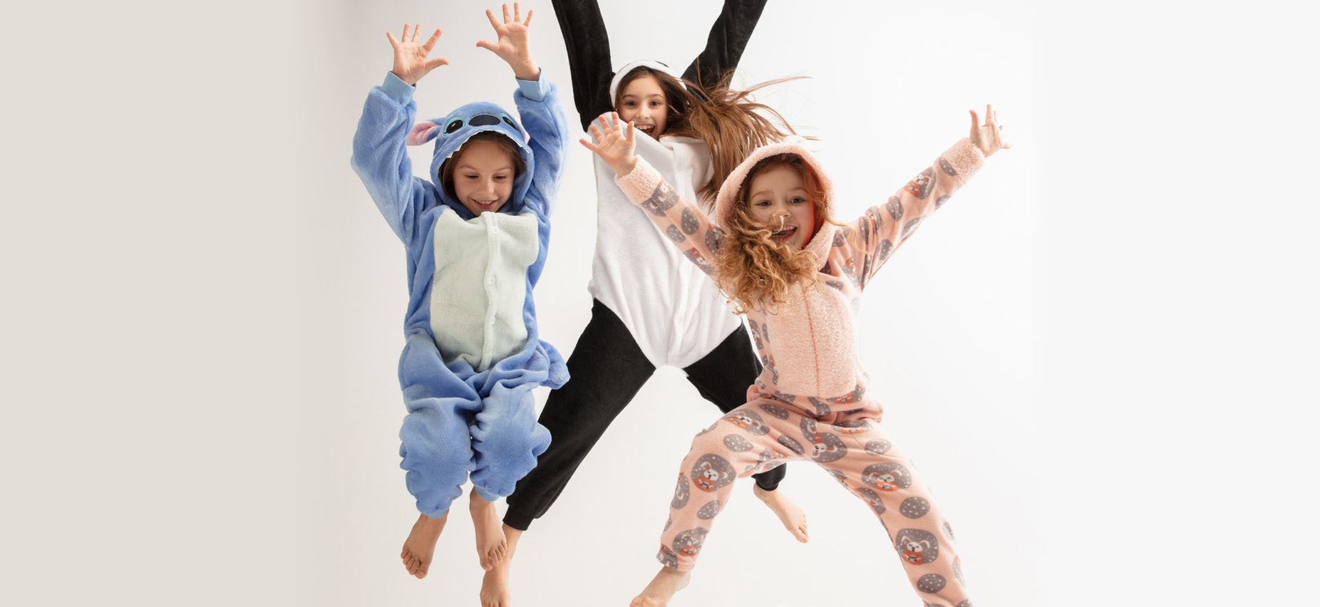 Kids in pajamas jumping