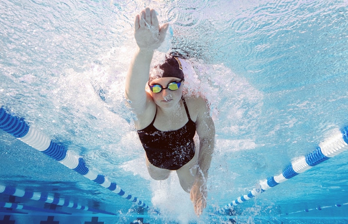 Underwater image of a female swimmer training at the Olympic size swimming pool