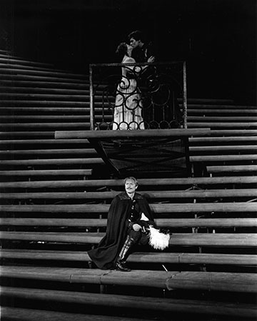John Cullum as Cyrano, seated, with Lisabeth Bartlett as Roxanne and Marcus Smythe as Christian in Cyrano de Bergerac. Season 1983 - 1984. 